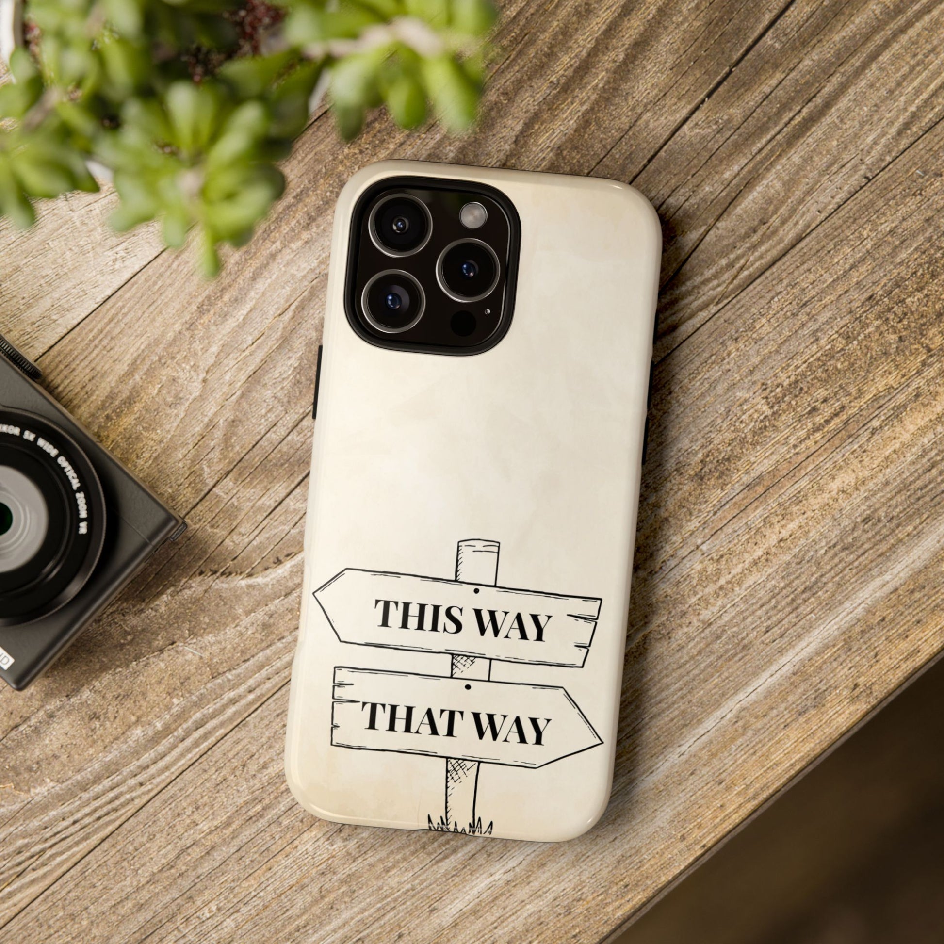 Storybook-style tough phone case with the iconic Wonderland signpost in black and white against a soft beige background. A timeless accessory for those who love fantasy art and durable design.
